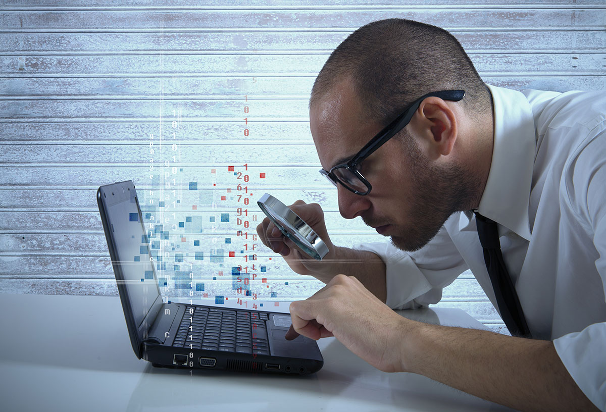 man reading blog post on computer and phone