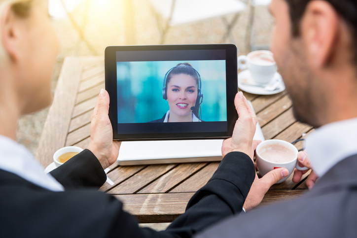 Tech professionals watching video together